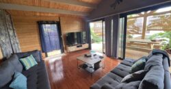 À vendre : Charmante maison bois F3 de plain-pied avec vue sur l’océan, dans un cadre idyllique à Saint-Louis